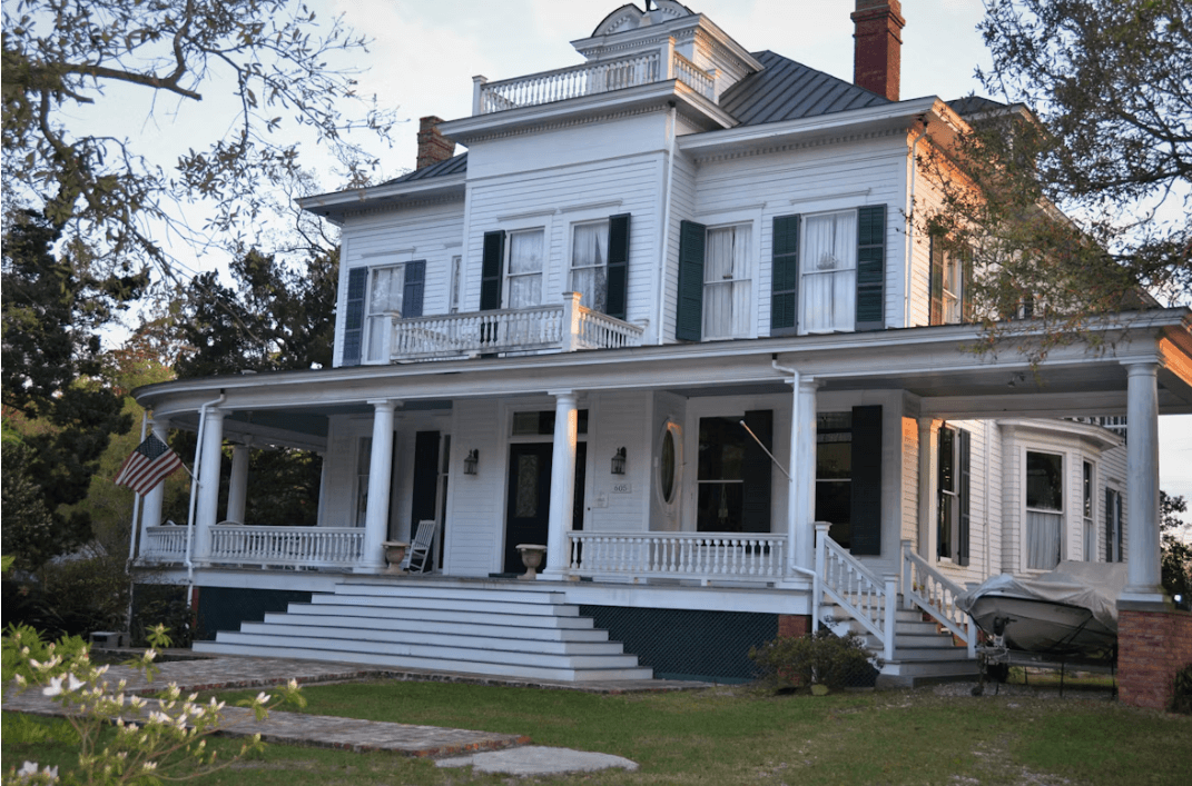 Elegant multi-storey residence with a broad front porch